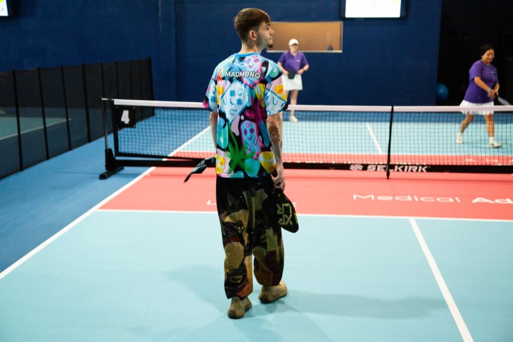 A player on court at a pickleball activation